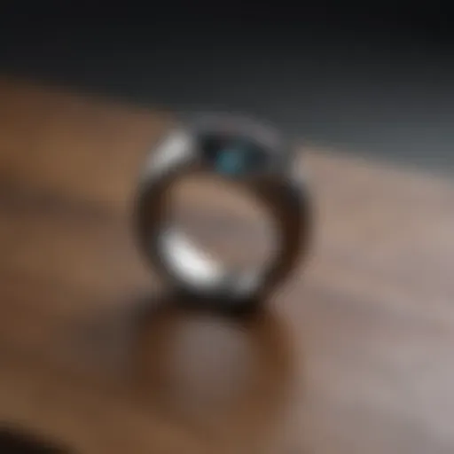 Sleek design of the Oura Ring showcased on a wooden surface