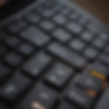 Close-up of Apple laptop keyboard with illuminated keys