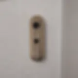 Close-up of a HomeKit contact sensor installed on a door frame