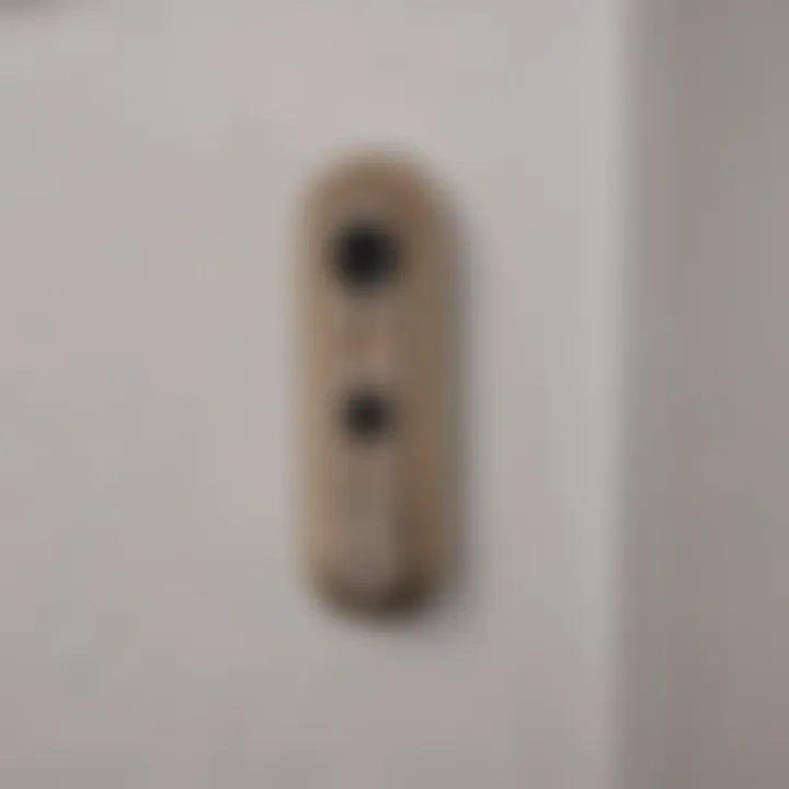 Close-up of a HomeKit contact sensor installed on a door frame