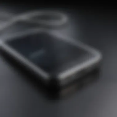 A close-up of an iPhone connected to a computer for reset.