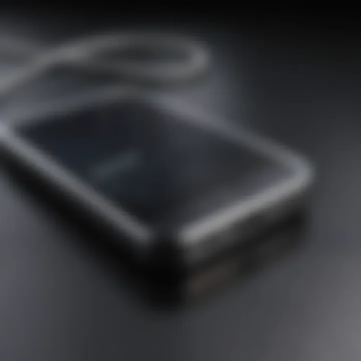 A close-up of an iPhone connected to a computer for reset.