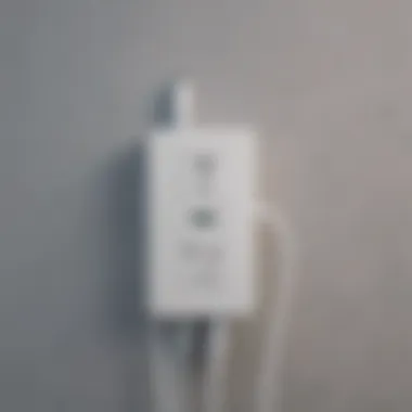 Apple laptop charger plugged into power outlet